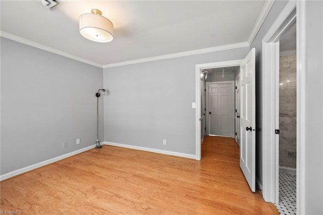 319 Hanover Arms Ct, Winston-Salem, NC 27104 - spare room with attic access, light wood-style floors, ornamental molding, and baseboards