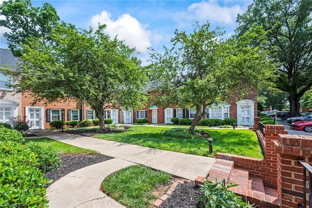 319 Hanover Arms Ct, Winston-Salem, NC 27104 - obstructed view of property with a front lawn and brick siding