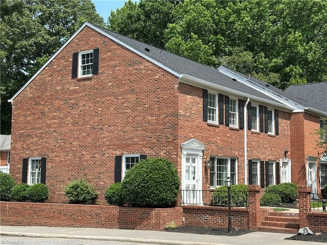319 Hanover Arms Ct, Winston-Salem, NC 27104 - colonial house with brick siding and a shingled roof