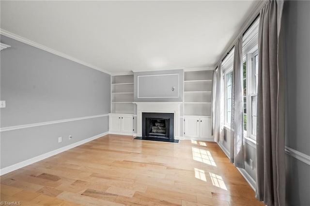 319 Hanover Arms Ct, Winston-Salem, NC 27104 - unfurnished living room featuring light wood-style flooring, a fireplace with flush hearth, baseboards, built in features, and ornamental molding