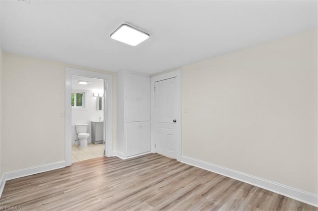 spare room with light hardwood / wood-style flooring