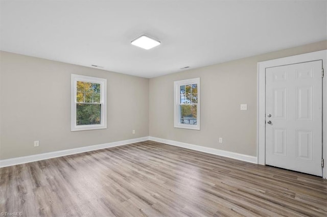 empty room featuring light hardwood / wood-style floors