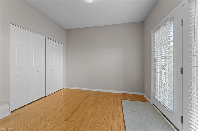 unfurnished bedroom featuring hardwood / wood-style floors