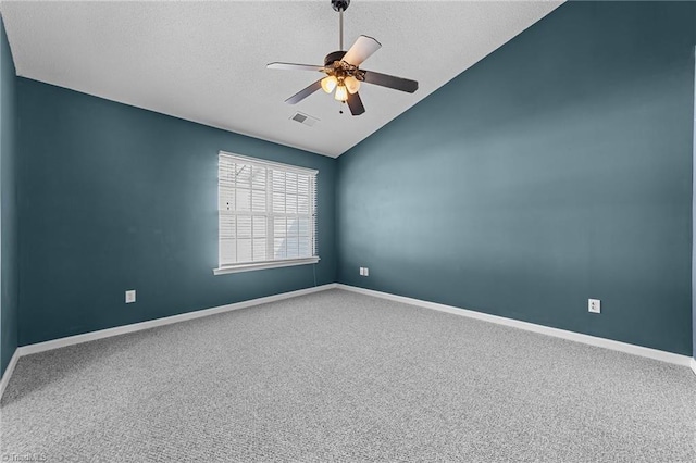 spare room with carpet floors, ceiling fan, and lofted ceiling