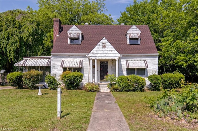 1900 Peachtree St, Winston-Salem, NC 27107 - cape cod house featuring a front lawn, a chimney, and a shingled roof