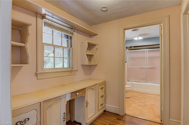 1900 Peachtree St, Winston-Salem, NC 27107 - unfurnished office with a textured ceiling and wood finished floors