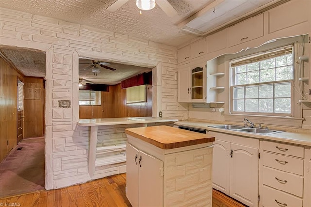 1900 Peachtree St, Winston-Salem, NC 27107 - kitchen with ceiling fan, wood counters, a sink, a center island, and a textured ceiling