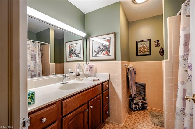 bathroom with tile walls and vanity