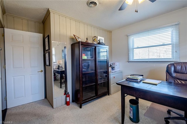 office space featuring ceiling fan, crown molding, and a textured ceiling