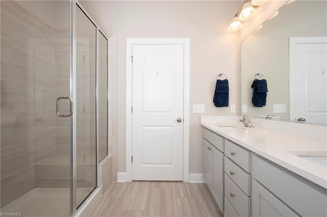 410 Mountain Grove Ln, Kernersville, NC 27284 - full bathroom with a stall shower, double vanity, and baseboards