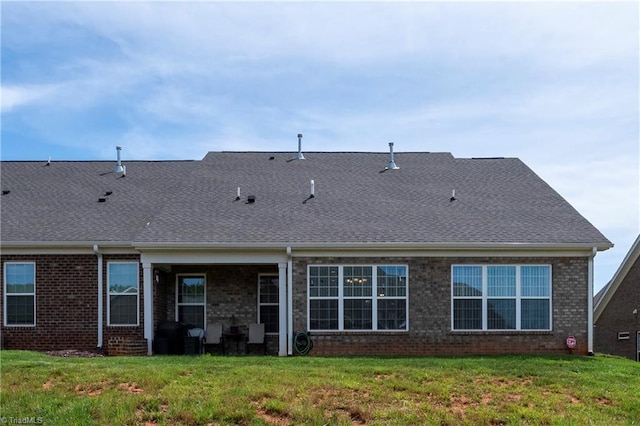 410 Mountain Grove Ln, Kernersville, NC 27284 - back of house with brick siding and a lawn