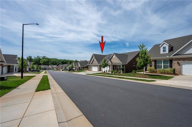 410 Mountain Grove Ln, Kernersville, NC 27284 - view of asphalt road with sidewalks, a residential view, and street lights