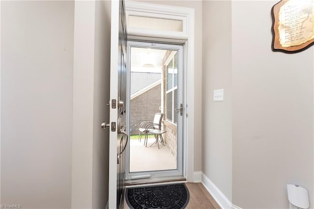410 Mountain Grove Ln, Kernersville, NC 27284 - doorway to outside featuring wood finished floors and baseboards