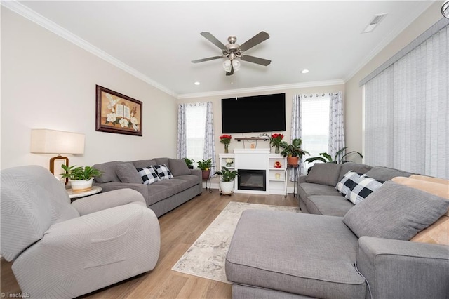 410 Mountain Grove Ln, Kernersville, NC 27284 - living area with plenty of natural light, light wood-style flooring, ornamental molding, a ceiling fan, and recessed lighting