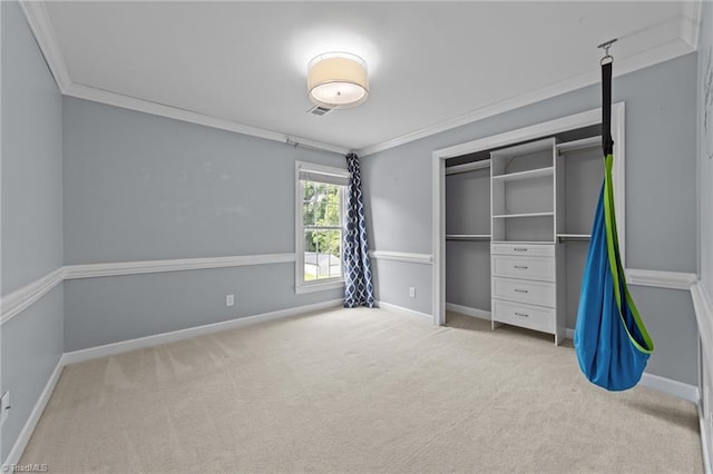 1203 Westminster Dr, Greensboro, NC 27410 - unfurnished bedroom with crown molding, carpet floors, and a closet
