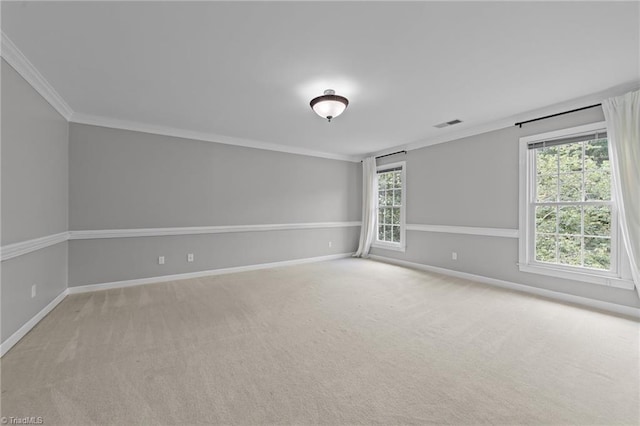 1203 Westminster Dr, Greensboro, NC 27410 - carpeted spare room featuring ornamental molding and healthy amount of natural light