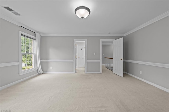 1203 Westminster Dr, Greensboro, NC 27410 - carpeted empty room featuring crown molding and baseboards