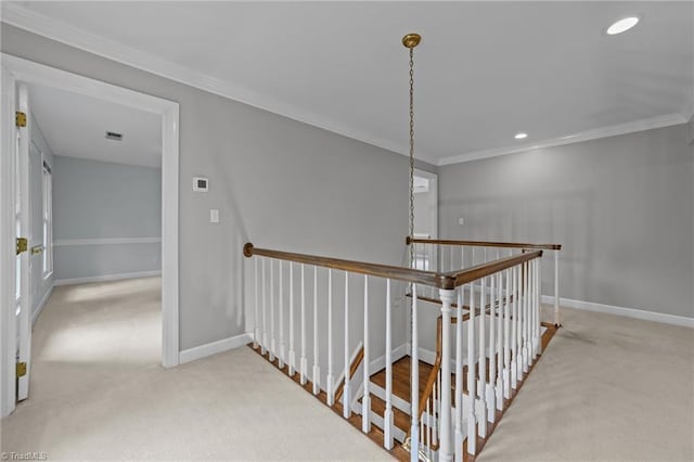 1203 Westminster Dr, Greensboro, NC 27410 - hall with an upstairs landing, carpet floors, crown molding, and recessed lighting