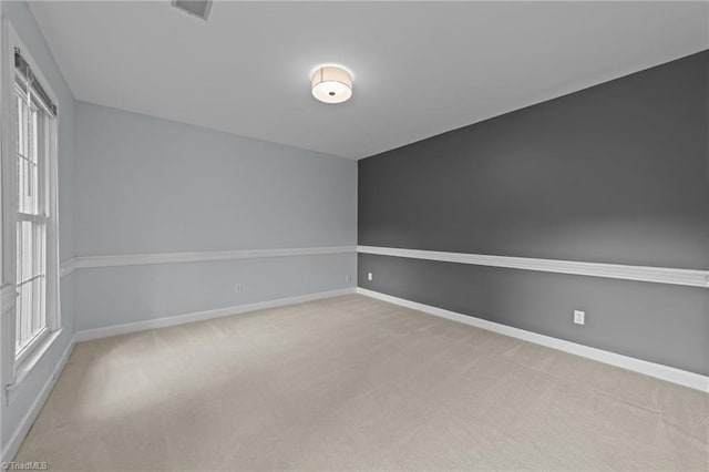 1203 Westminster Dr, Greensboro, NC 27410 - carpeted empty room featuring baseboards
