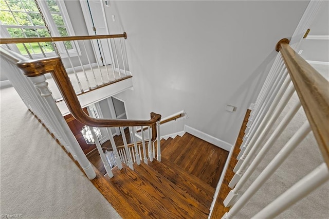 1203 Westminster Dr, Greensboro, NC 27410 - staircase with wood finished floors and baseboards