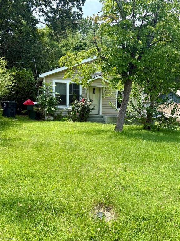 3106 Four Seasons Blvd, Greensboro, NC 27406 - view of front of home featuring a front lawn
