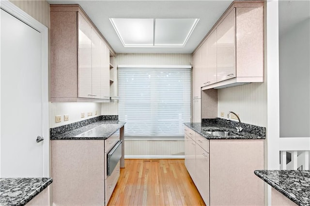 881 Brookleigh Ct, Winston-Salem, NC 27104 - kitchen with a sink, light wood-type flooring, and dark stone countertops