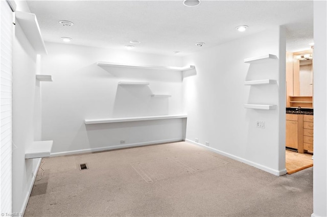 881 Brookleigh Ct, Winston-Salem, NC 27104 - unfurnished living room with carpet flooring, baseboards, and recessed lighting
