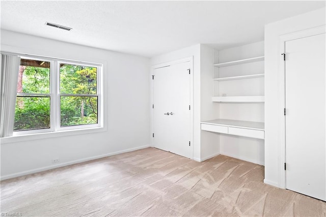 881 Brookleigh Ct, Winston-Salem, NC 27104 - unfurnished bedroom with light colored carpet, baseboards, and a desk