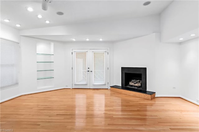 881 Brookleigh Ct, Winston-Salem, NC 27104 - unfurnished living room with light wood-type flooring, built in features, french doors, baseboards, and recessed lighting