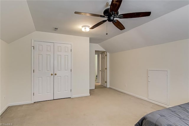 4317 Bradbury Way, High Point, NC 27265 - bedroom with light carpet, vaulted ceiling, a closet, and ceiling fan