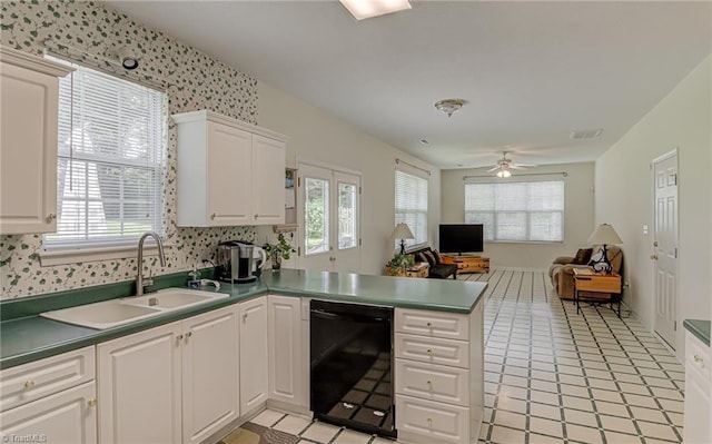 4317 Bradbury Way, High Point, NC 27265 - kitchen featuring dishwasher, a peninsula, open floor plan, white cabinets, and ceiling fan