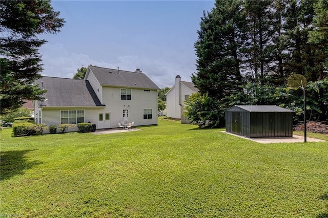 4317 Bradbury Way, High Point, NC 27265 - back of house with a lawn, a patio area, and an outbuilding