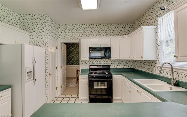 4317 Bradbury Way, High Point, NC 27265 - kitchen featuring black appliances, wallpapered walls, white cabinets, light tile patterned floors, and dark countertops