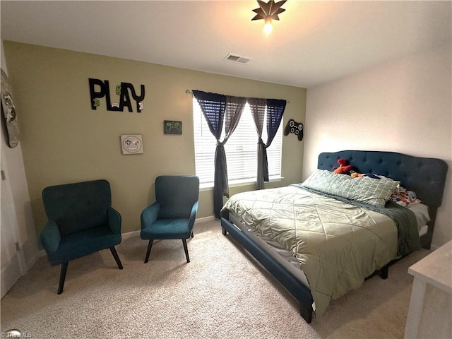 bedroom with light colored carpet, baseboards, and visible vents