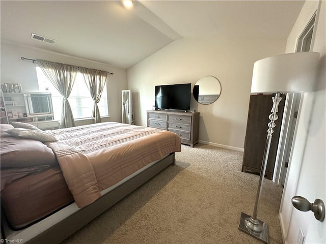 bedroom with visible vents, carpet floors, baseboards, and lofted ceiling
