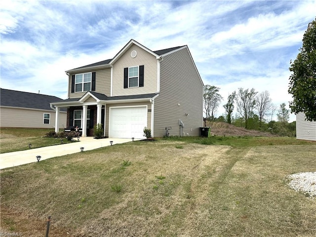 view of front of home with an attached garage, concrete driveway, and a front yard