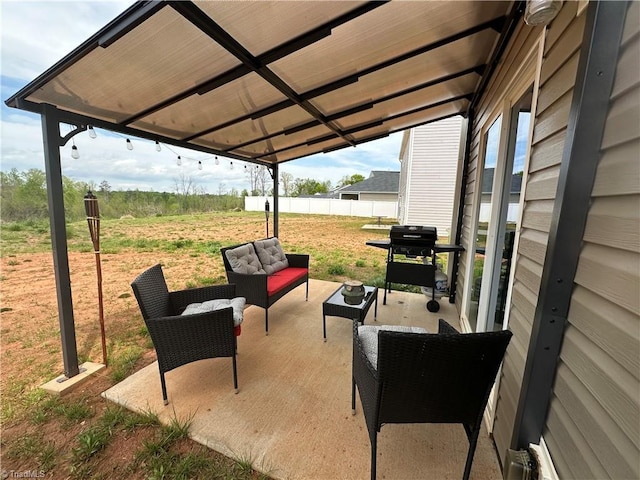 view of patio / terrace featuring an outdoor living space, a grill, and fence
