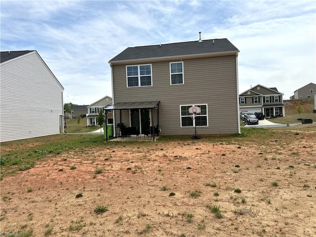 back of house with a patio