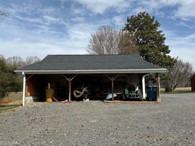 view of pole building with driveway