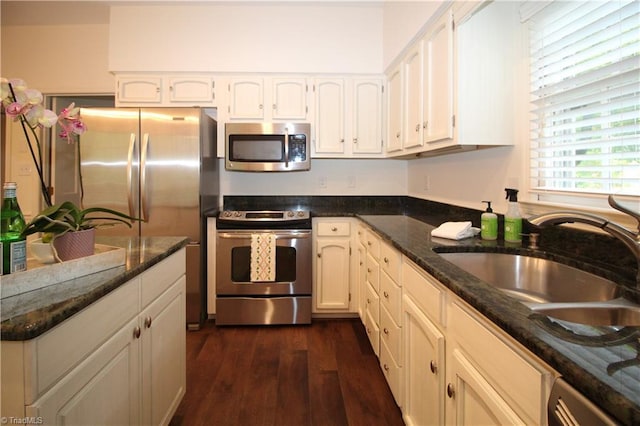 39 Fountain Manor Dr Unit A, Greensboro, NC 27405 - kitchen with stainless steel appliances, a sink, dark wood-style flooring, and white cabinetry
