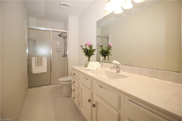 39 Fountain Manor Dr Unit A, Greensboro, NC 27405 - full bathroom with vanity, toilet, a shower stall, tile patterned flooring, and baseboards