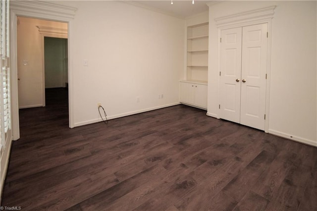 39 Fountain Manor Dr Unit A, Greensboro, NC 27405 - unfurnished bedroom featuring ornamental molding, dark wood-style flooring, and baseboards