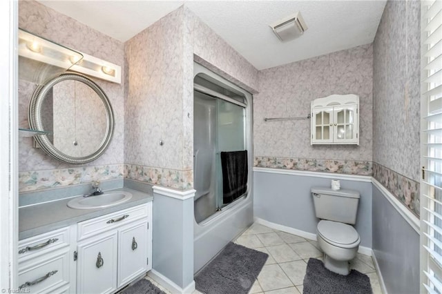 bathroom with wallpapered walls, toilet, and tile patterned flooring