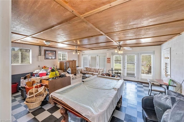 recreation room with tile patterned floors, a healthy amount of sunlight, and ceiling fan
