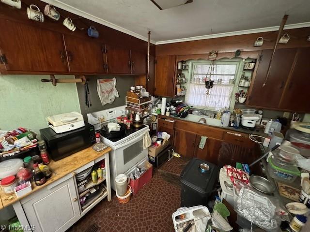 kitchen with sink and white electric range oven