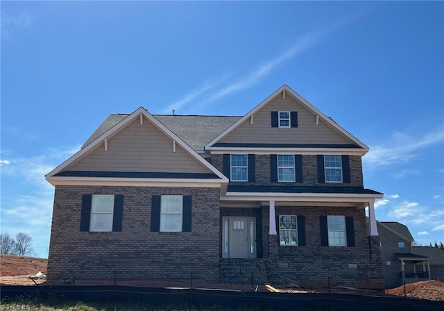 view of front of home with brick siding