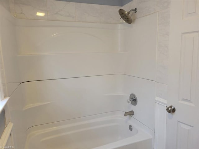 bathroom with washtub / shower combination