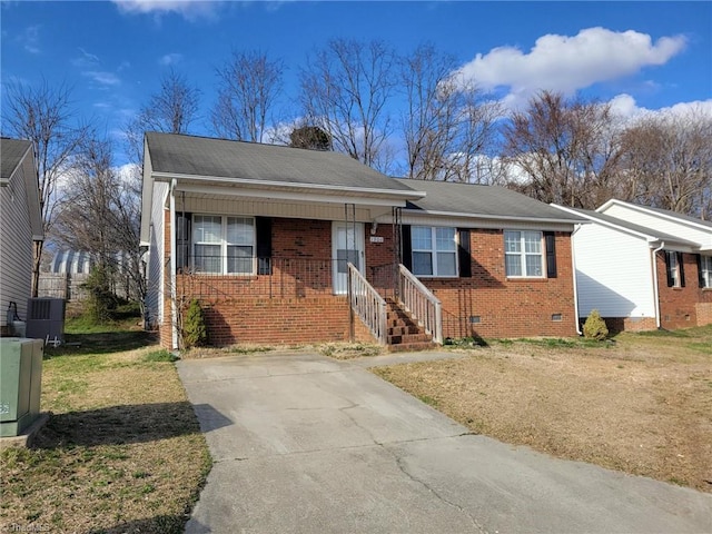 view of front facade with brick siding, central air condition unit, a front yard, roof with shingles, and crawl space