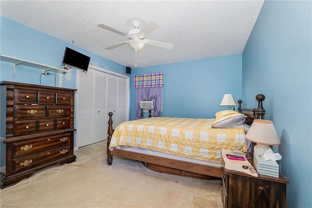 6215 Russwood Dr, Pleasant Garden, NC 27313 - carpeted bedroom featuring a closet, ceiling fan, and a textured ceiling