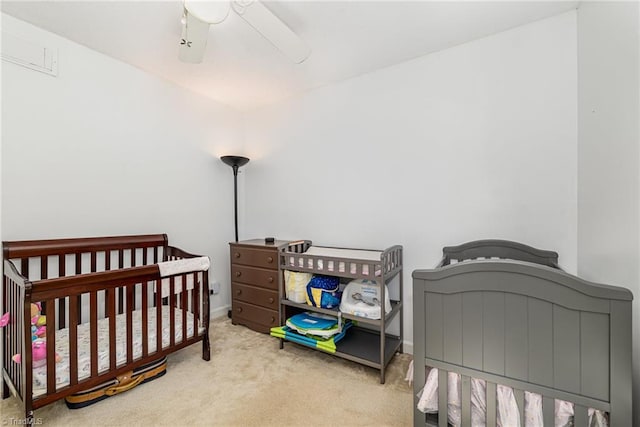 6215 Russwood Dr, Pleasant Garden, NC 27313 - bedroom with carpet, a ceiling fan, a crib, and baseboards